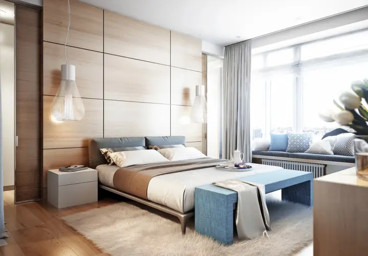 Camera da letto moderna con testiera in legno, letti comodi e un angolo relax vicino alla finestra, come nei comuni di Ischia.